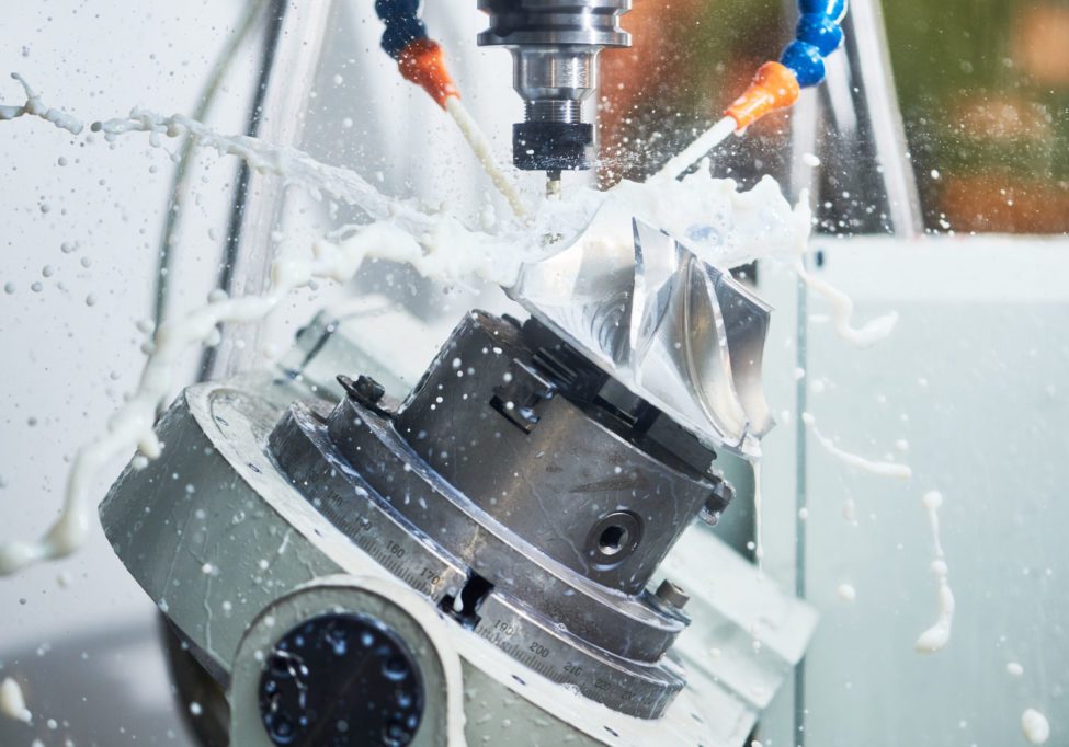Milling metalworking process. Industrial CNC metal machining by vertical mill Milling metalworking process. Industrial CNC machining of metal detail by cutting end-tooth vertical mill at factory