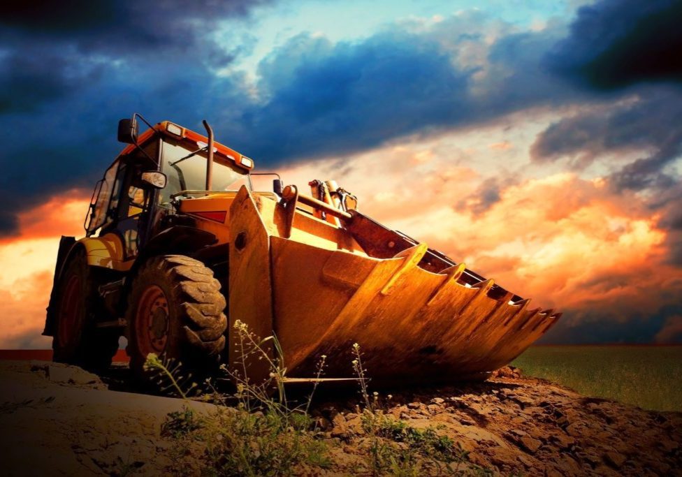 8255242 - yellow tractor on golden surise sky